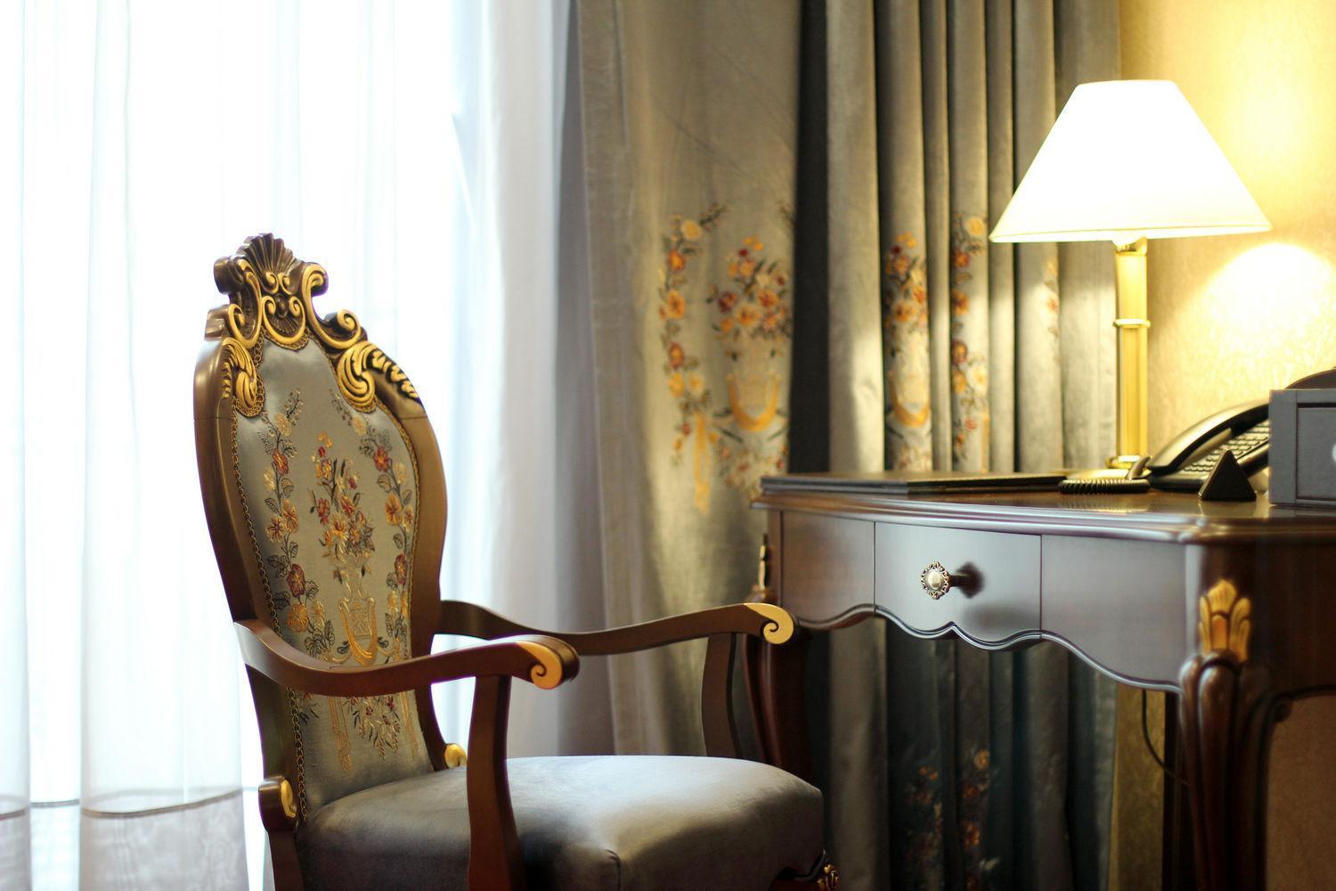 Orion Hotel Bisjkek Buitenkant foto A chair