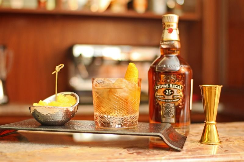 Orion Hotel Bisjkek Buitenkant foto A bottle of 25 year old Chivas Regal