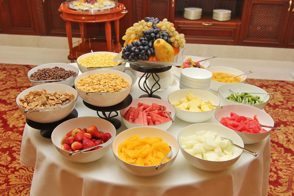 Orion Hotel Bisjkek Buitenkant foto Fruit salad
