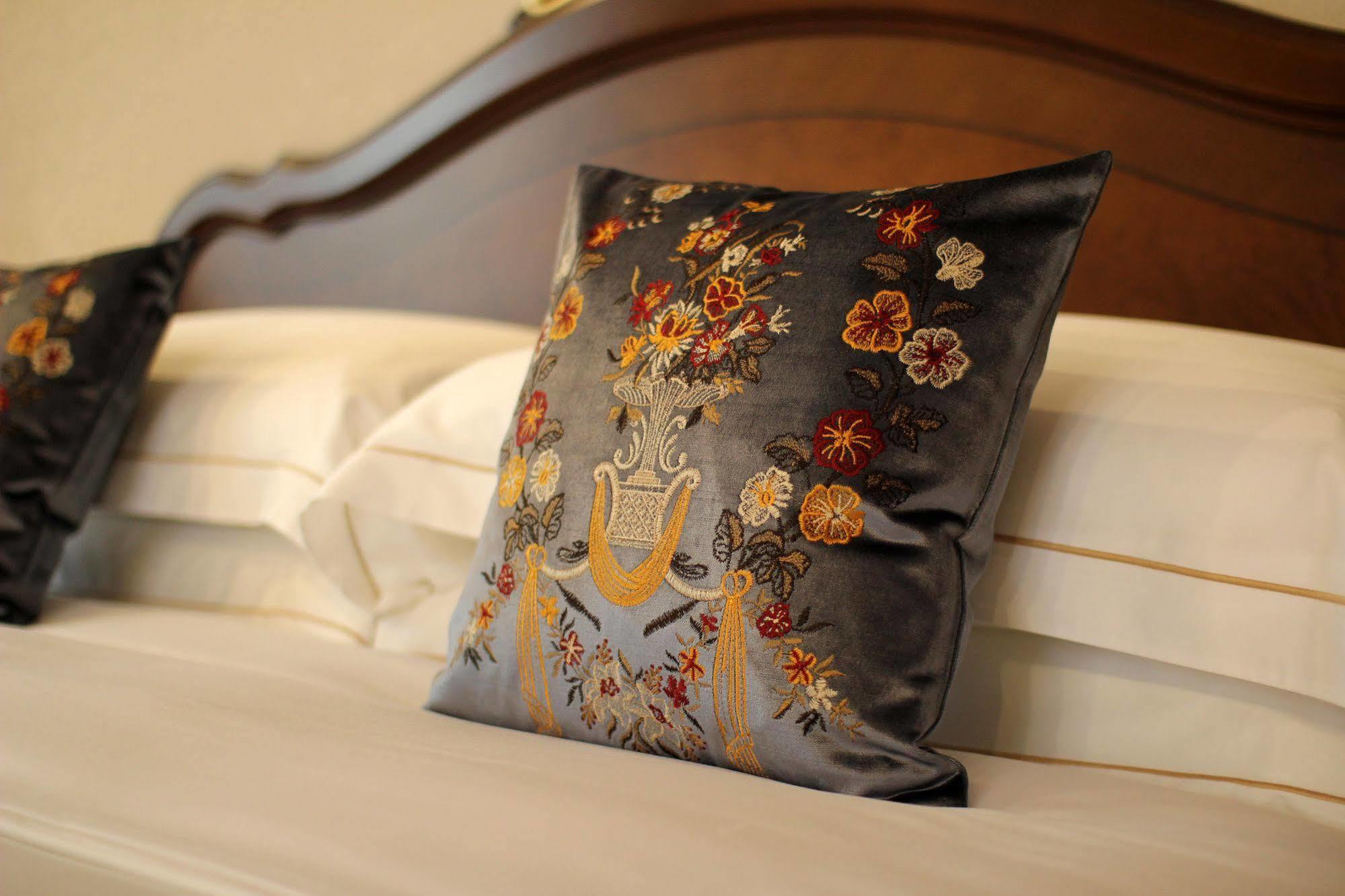 Orion Hotel Bisjkek Buitenkant foto A cushion