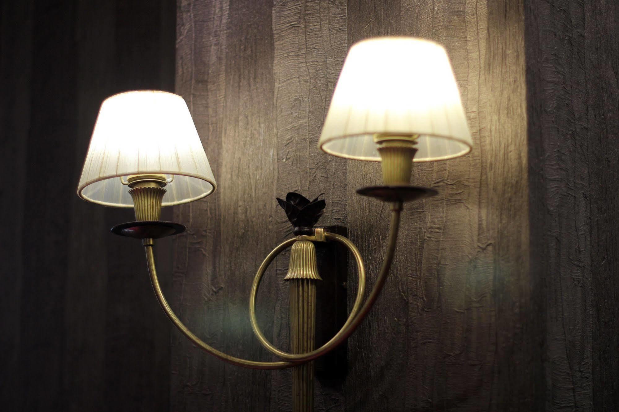 Orion Hotel Bisjkek Buitenkant foto A wall light